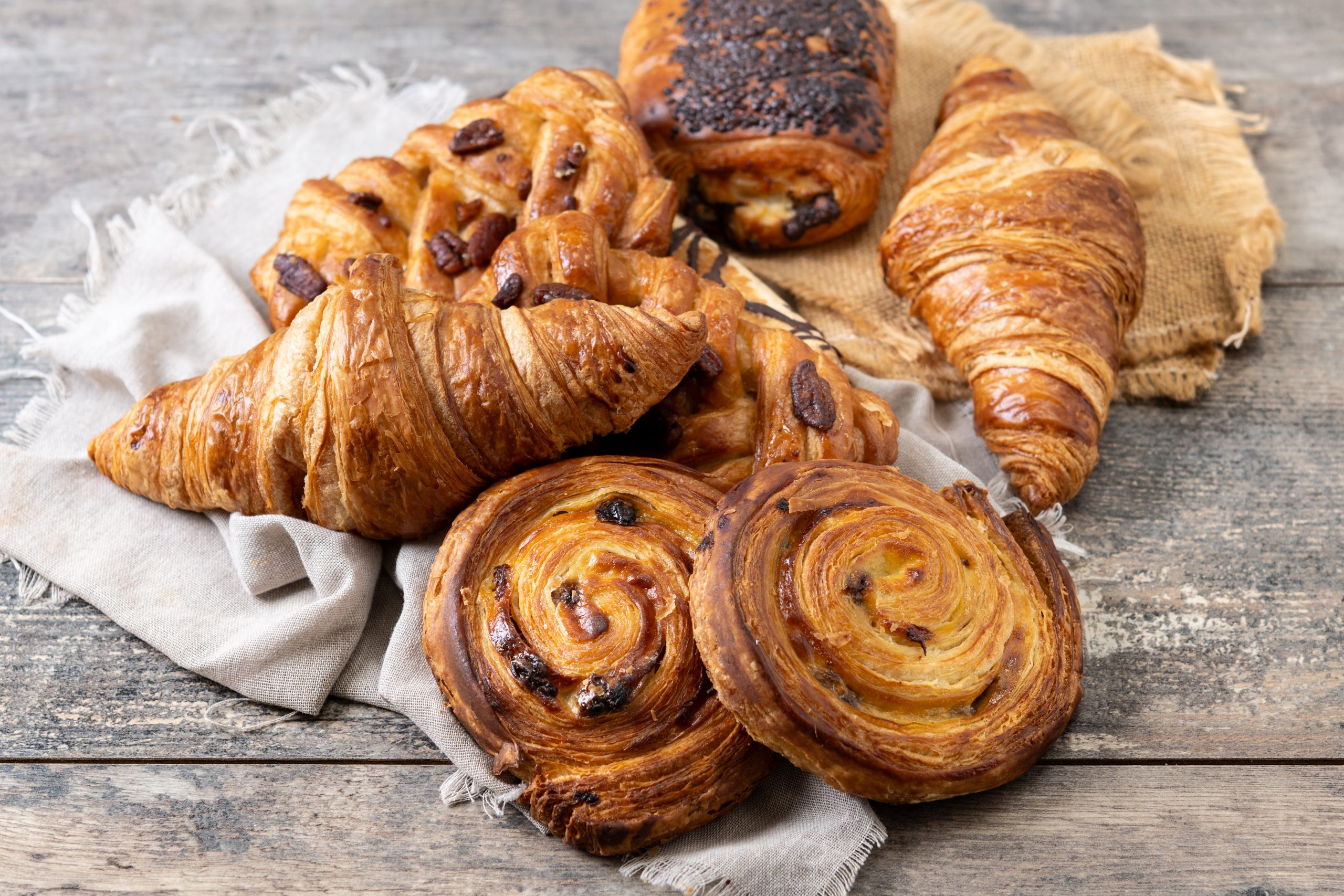 Set of bakery pastries on wooden table