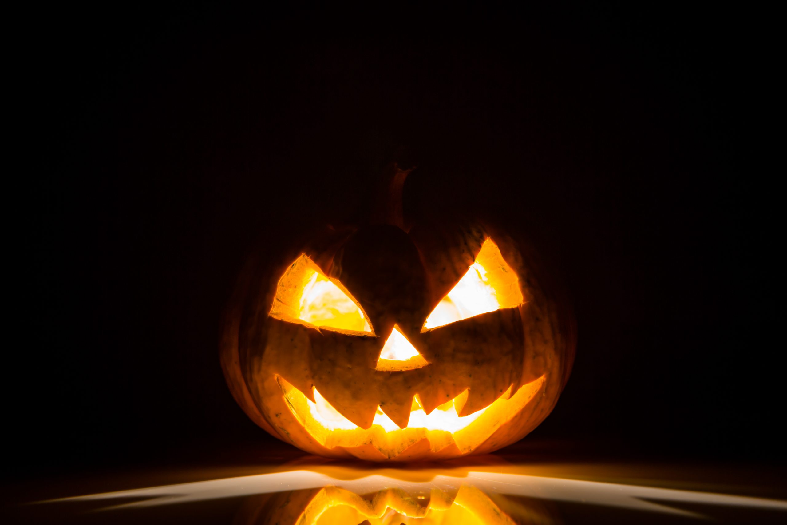 Halloween scary face pumpkin on black background